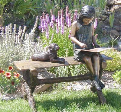 Girl Reading on Bench with Dog