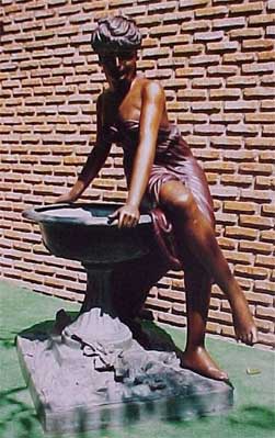 Woman Sitting on Fountain